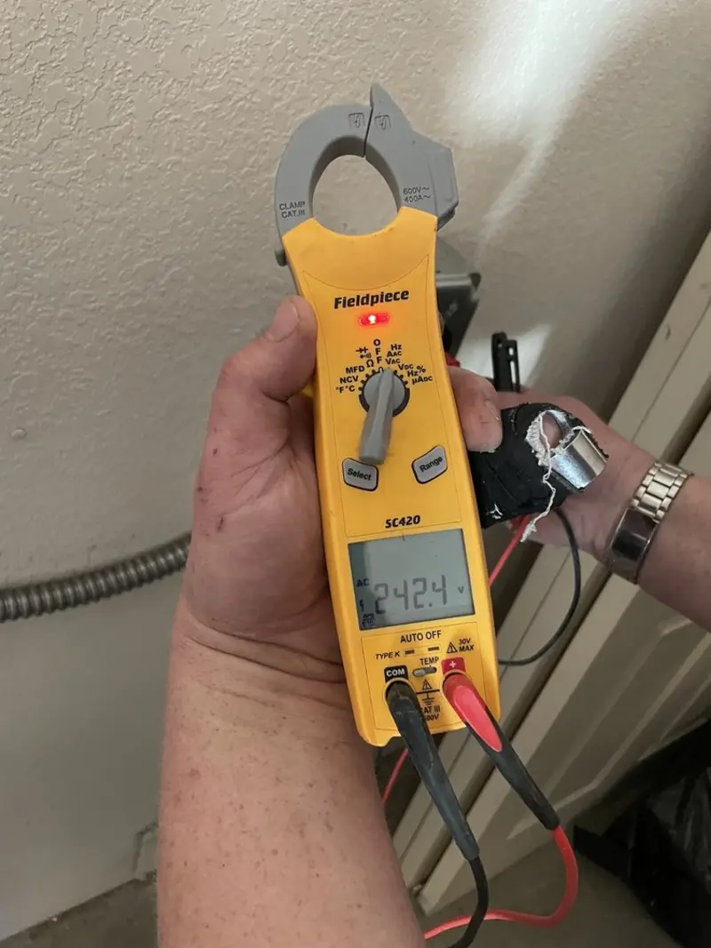 Voltage testing with clamp meter during Ceiling Fan Installation in Rayville